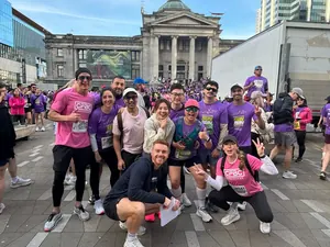 CrossFit BC team in pink CFBC shirts at the Vancouver Sun Run, Art Gallery plaza