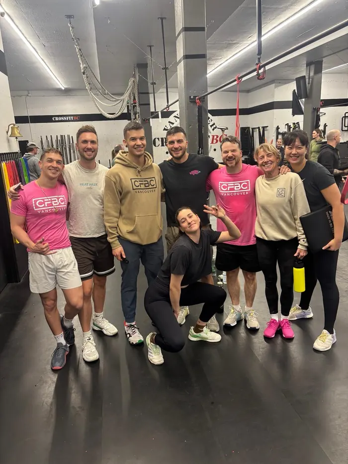 CrossFit BC crew celebrating in CFBC hoodies inside the gym