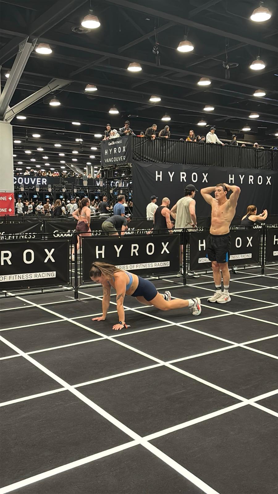 CrossFit BC athletes training HYROX-style with sleds, broad jumps, and group conditioning in Vancouver's Olympic Village gym