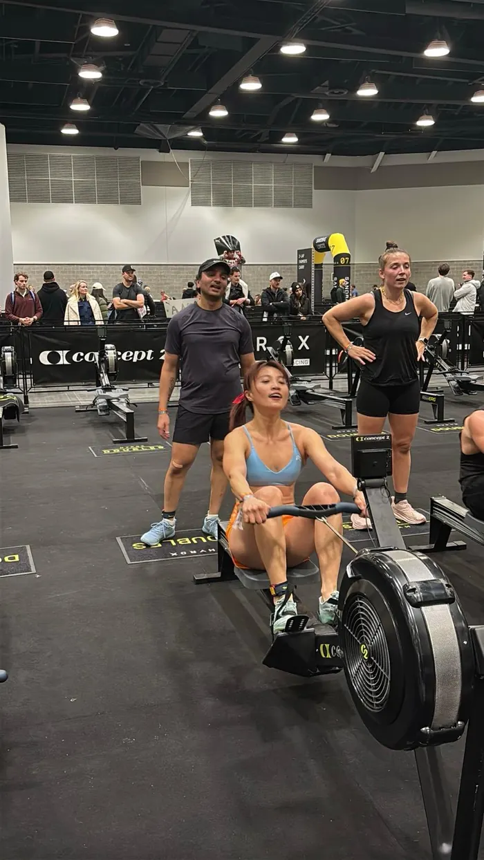 CrossFit BC member powering through a rowing piece