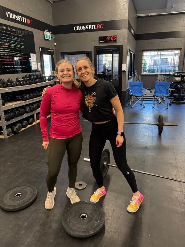 Members laughing together after a class at CrossFit BC