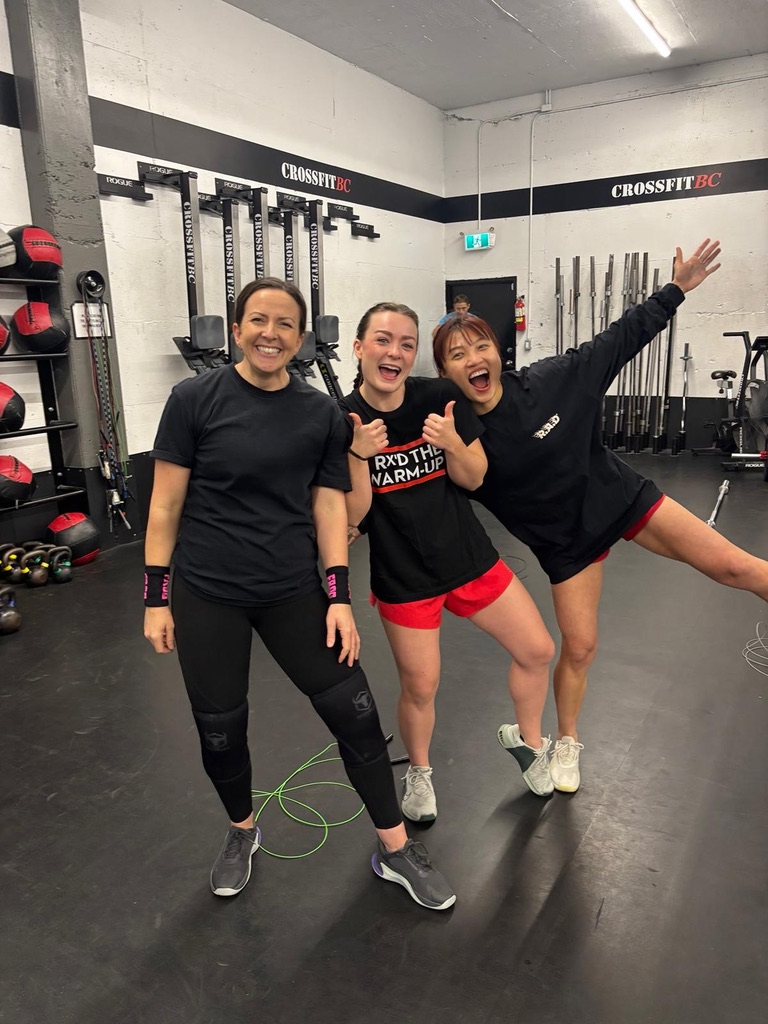 Three women celebrating after a workout