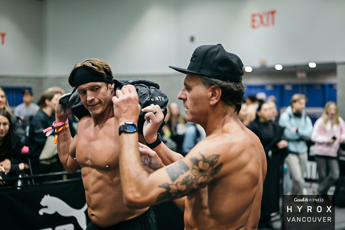 Athlete training sandbag lunges for HYROX at CrossFit BC