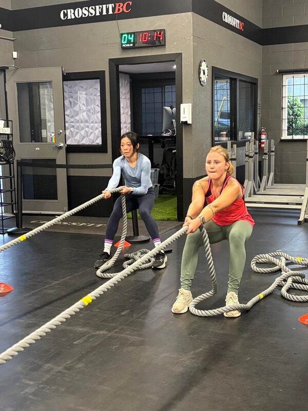 Member working on rope climbs during a CrossFit class