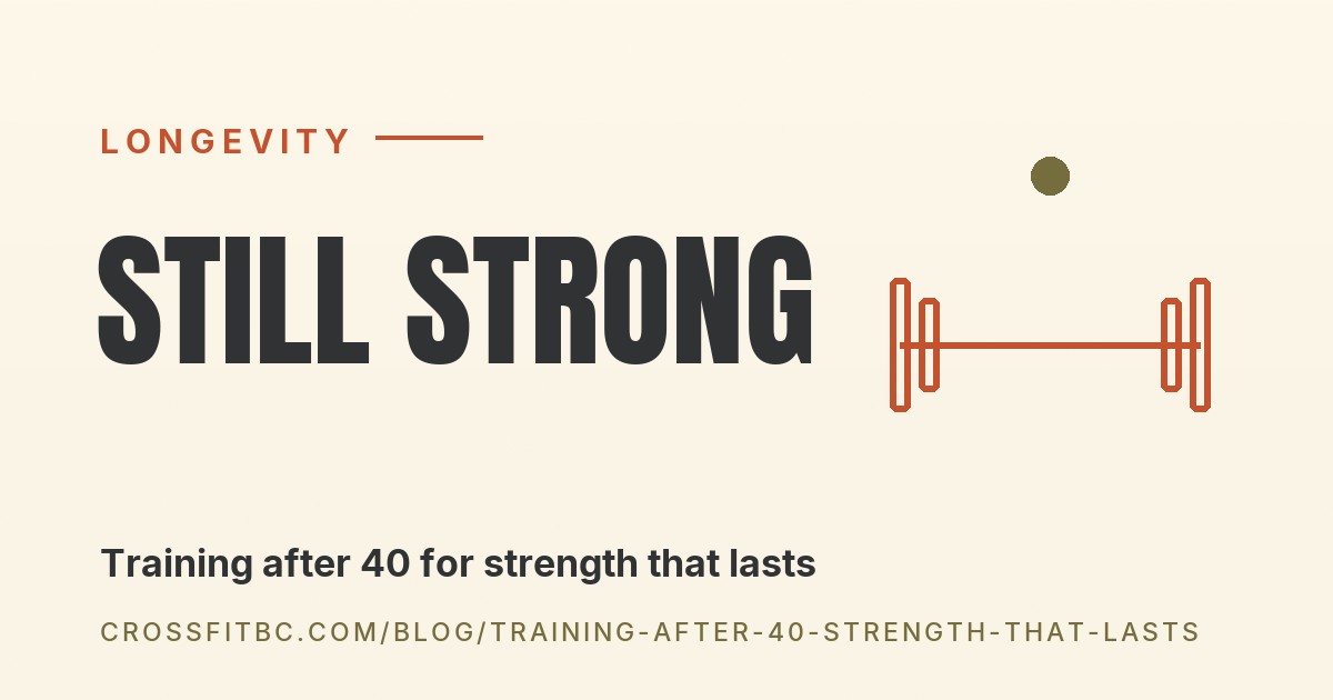 A CrossFit BC member in their 50s pulling a heavy deadlift under coach supervision