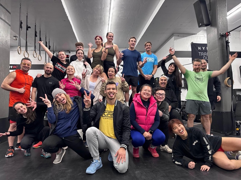 Large CrossFit BC community group photo inside the Olympic Village gym
